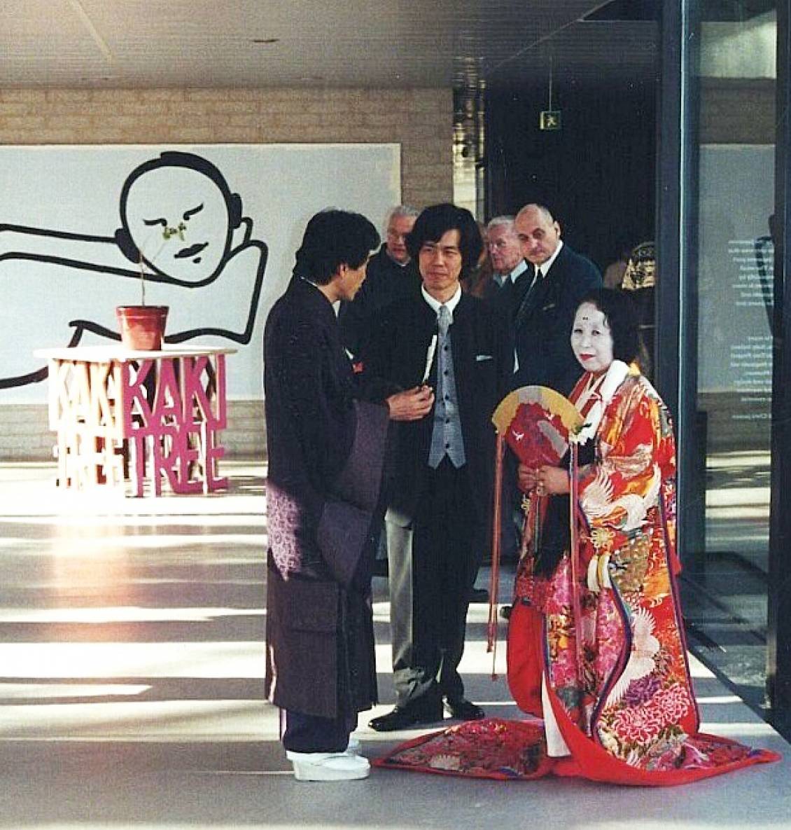 Hiroyuki Nakazawa and assistant during the opening of 'IKIRO/Be alive', 2001