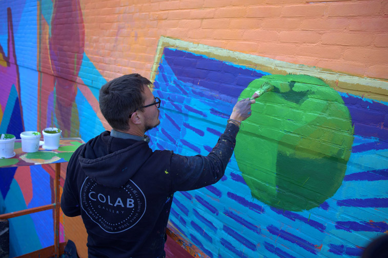 Fred Battle working on his mural